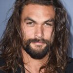 A headshot of Jason Momoa.