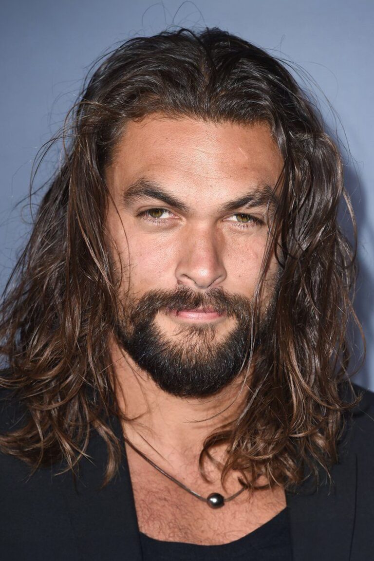 A headshot of Jason Momoa.