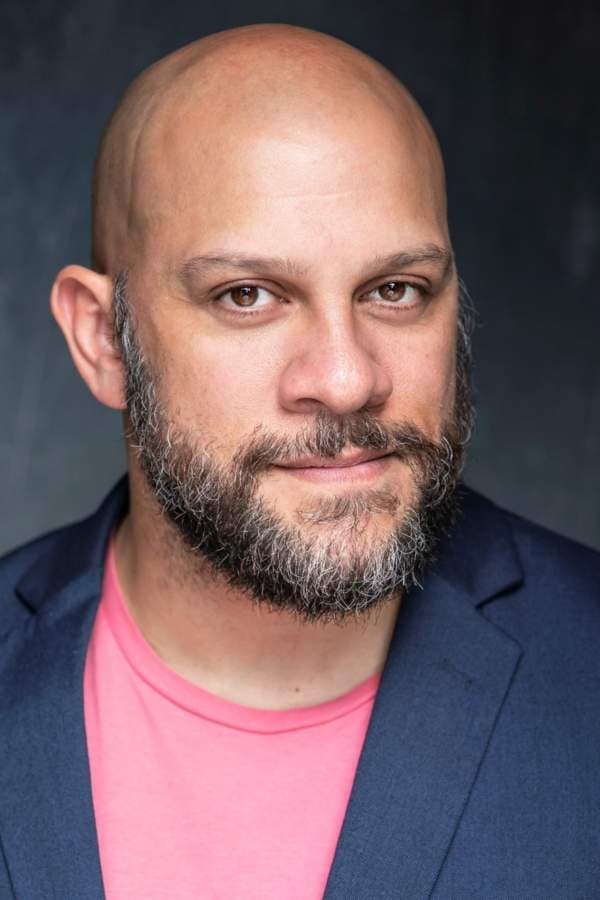 A headshot of Allan Henry.