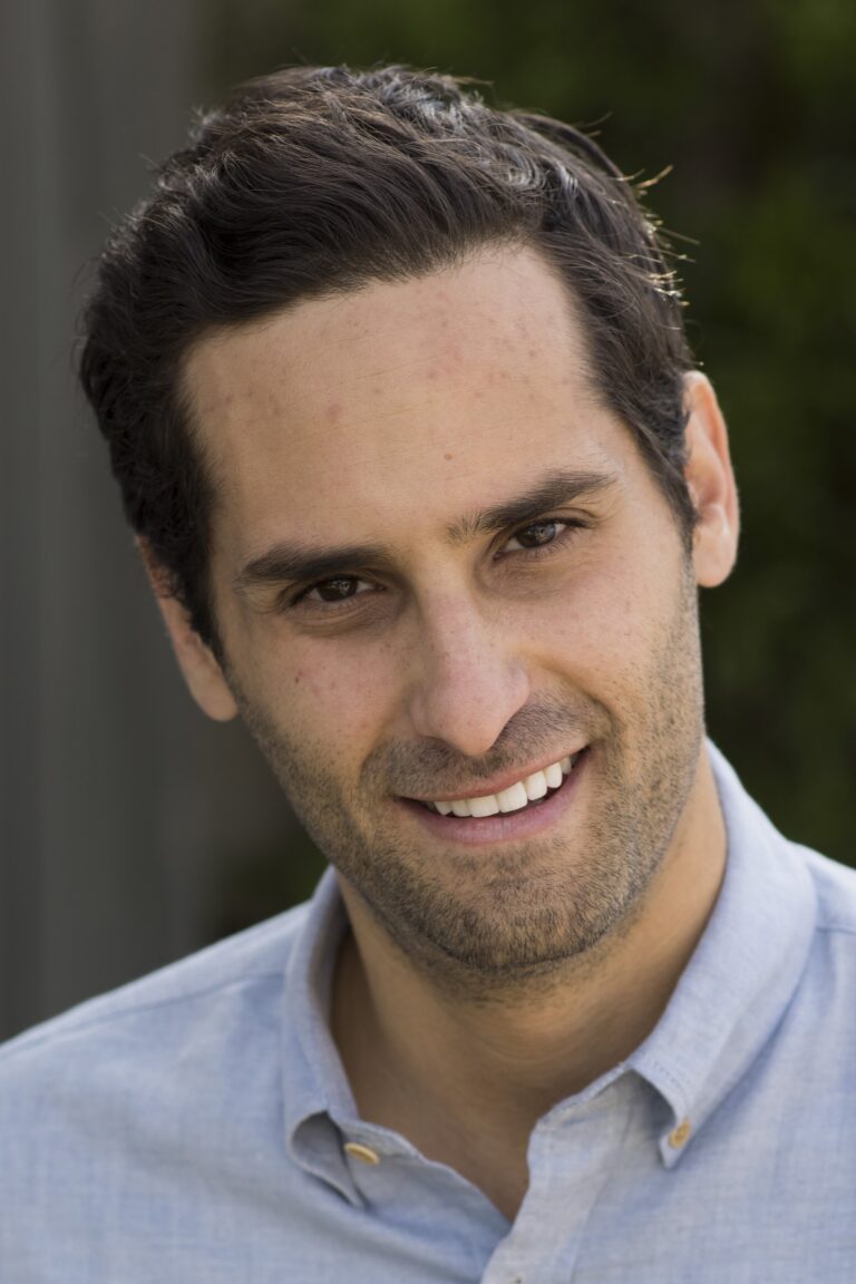 A headshot of Doug Mand.